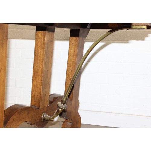 86 - An early 20th century walnut extending dining table with decorative Spanish Baroque style base, with... 