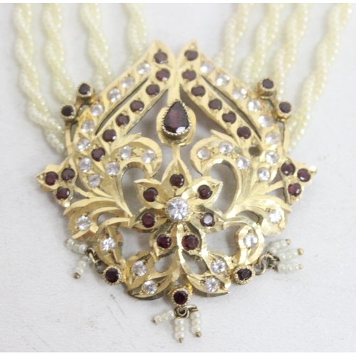 A highly decorative silver gilt seed pearl necklace set with white and ...