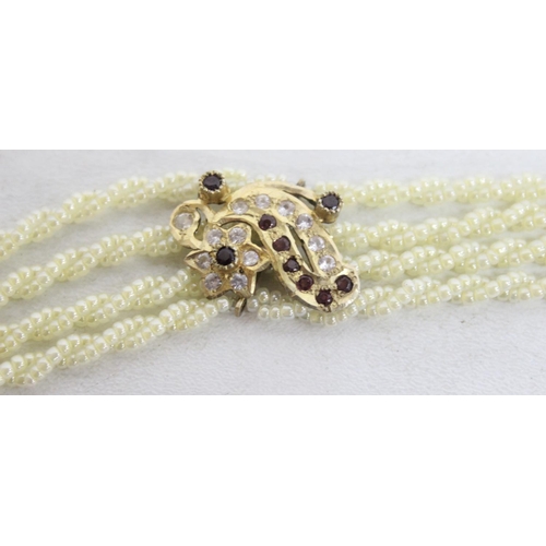 A highly decorative silver gilt seed pearl necklace set with white and ...