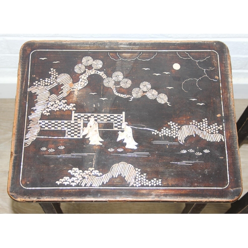 179 - Nest of two oriental style lacquered tables with mother of pearl inlay and a light oak side table wi... 