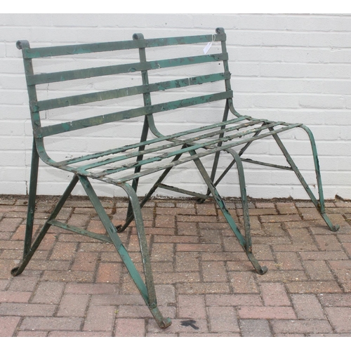 324 - Antique green painted wrought iron garden bench with scroll end detail, late 19th or early 20th cent... 