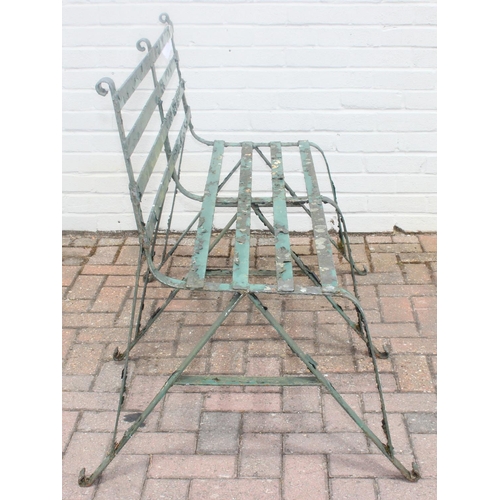 324 - Antique green painted wrought iron garden bench with scroll end detail, late 19th or early 20th cent... 