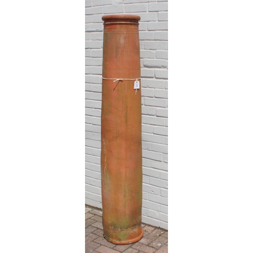 328 - Very tall terracotta chimney pot with impressed detail near rim, 180cm tall