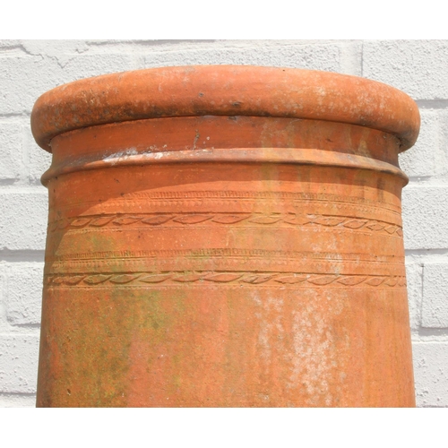 328 - Very tall terracotta chimney pot with impressed detail near rim, 180cm tall
