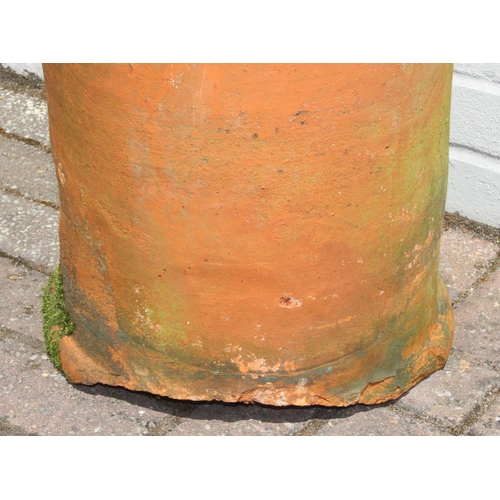 328 - Very tall terracotta chimney pot with impressed detail near rim, 180cm tall