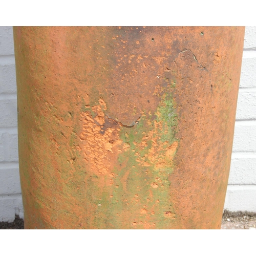 328 - Very tall terracotta chimney pot with impressed detail near rim, 180cm tall