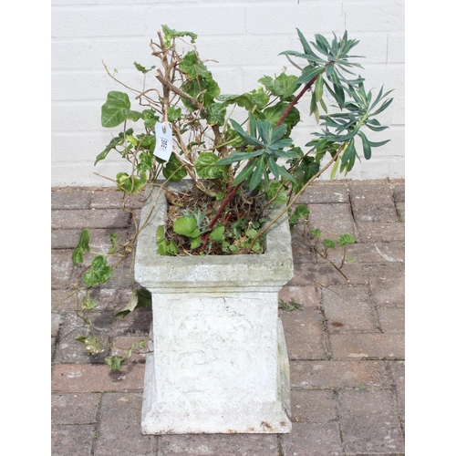 305 - A weathered garden planter with plants, the planter alone 37cm x 25cm x 30cm