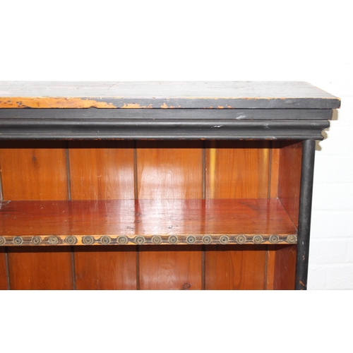 92 - An antique black painted pine bookcase with decorative roundels to shelf, approx 161cm x 30cm x 134c... 