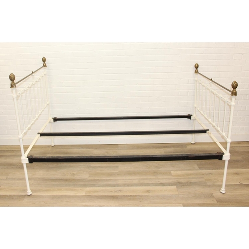 115 - A vintage white painted cast iron and brass small double bed frame, likely late Victorian, 122cm x 2... 
