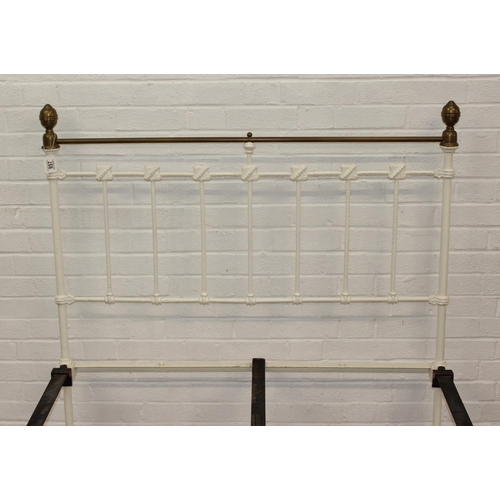 115 - A vintage white painted cast iron and brass small double bed frame, likely late Victorian, 122cm x 2... 