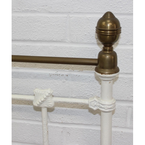 115 - A vintage white painted cast iron and brass small double bed frame, likely late Victorian, 122cm x 2... 