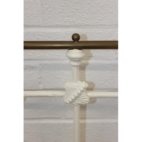 115 - A vintage white painted cast iron and brass small double bed frame, likely late Victorian, 122cm x 2... 