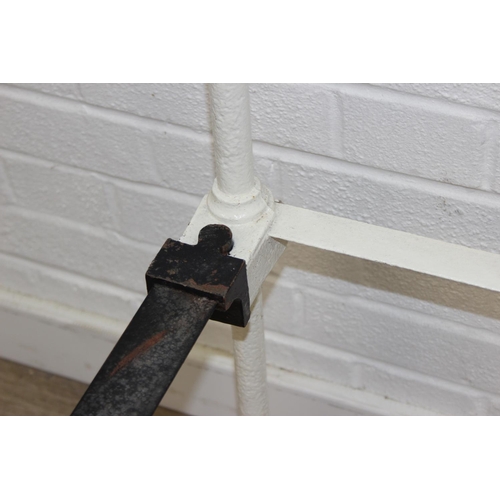 115 - A vintage white painted cast iron and brass small double bed frame, likely late Victorian, 122cm x 2... 