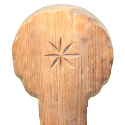 46 - An unusual vintage pitch pine spinning chair with carved decoration, three legs, 87cm tall