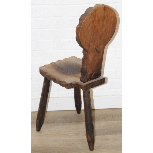 46 - An unusual vintage pitch pine spinning chair with carved decoration, three legs, 87cm tall
