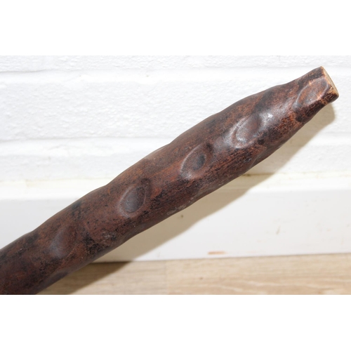 46 - An unusual vintage pitch pine spinning chair with carved decoration, three legs, 87cm tall