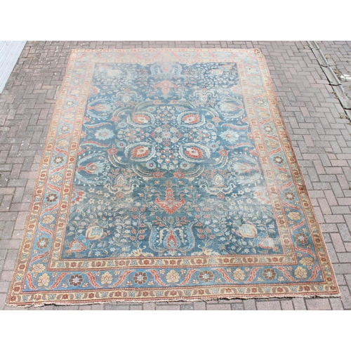 224 - A large vintage Persian rug, believed to be a Tabriz, blue ground with red border, 380cm x 274cm