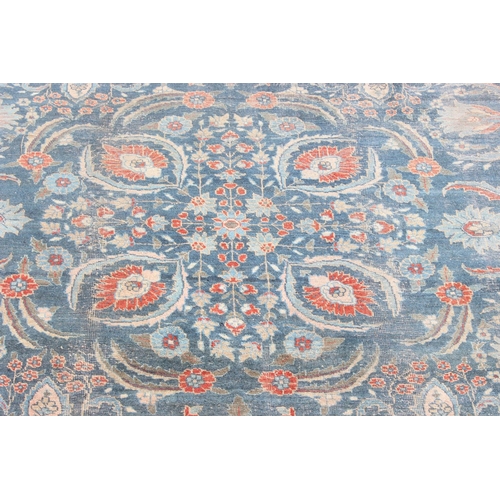 224 - A large vintage Persian rug, believed to be a Tabriz, blue ground with red border, 380cm x 274cm