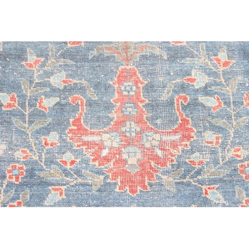 224 - A large vintage Persian rug, believed to be a Tabriz, blue ground with red border, 380cm x 274cm