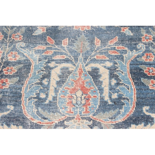 224 - A large vintage Persian rug, believed to be a Tabriz, blue ground with red border, 380cm x 274cm