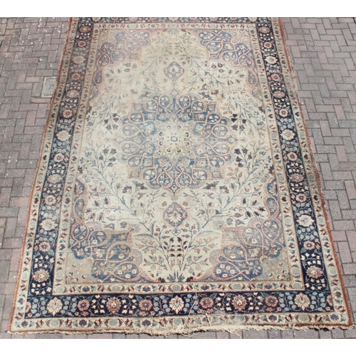 225 - A large vintage Perisan rug, believed to be a Tabriz, blue ground with dark blue border, 380cm x 274... 