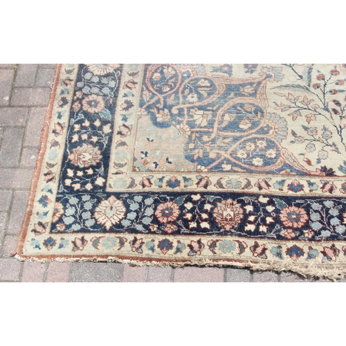 225 - A large vintage Perisan rug, believed to be a Tabriz, blue ground with dark blue border, 380cm x 274... 
