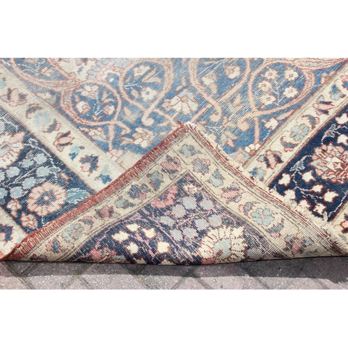 225 - A large vintage Perisan rug, believed to be a Tabriz, blue ground with dark blue border, 380cm x 274... 