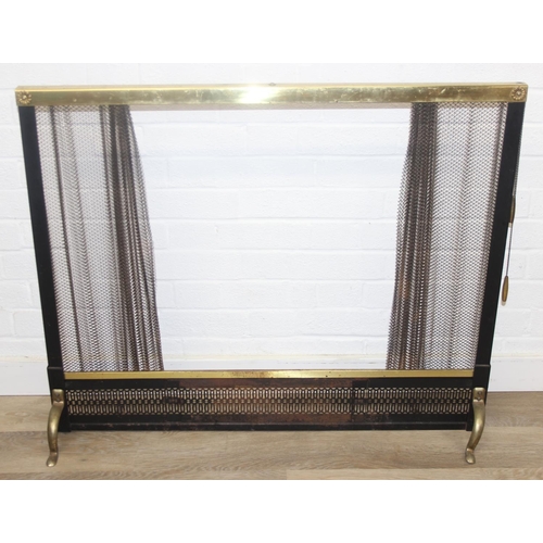 299B - An unusual antique style brass fire screen with metal chain-mail mesh drapery on pulley system, 97cm... 