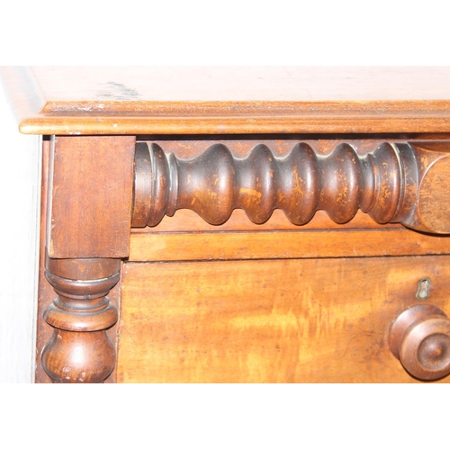 31 - A Victorian mahogany chest of drawers with decorative turned adornments, two over three, 128cm x 48c... 