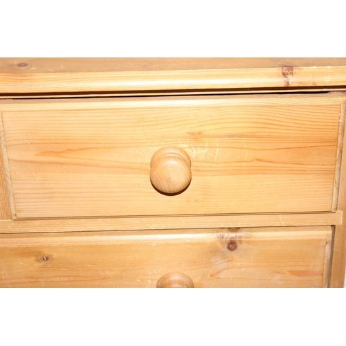 50 - A modern pine two over four chest of drawers with bun handles, 90cm x 40cm x 103cm, one of two in th... 