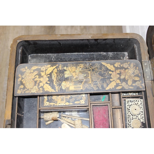 32 - A 19th century Chinese export lacquer work table or sewing table, the top with rounded corners, deco... 