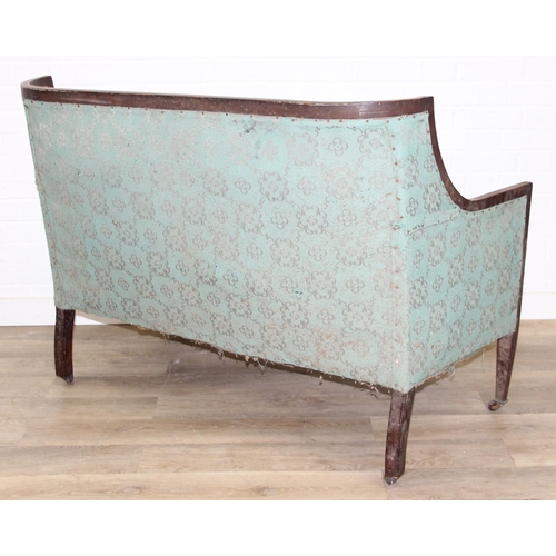 199 - A Regency style turquoise green patterned sofa and armchair with exposed mahogany frame and brass ca... 