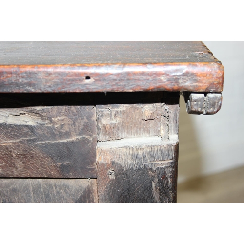195 - An antique oak coffer with carved details and candle box to interior, likely 18th century, unusual s... 