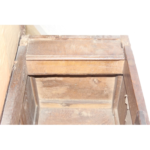 195 - An antique oak coffer with carved details and candle box to interior, likely 18th century, unusual s... 