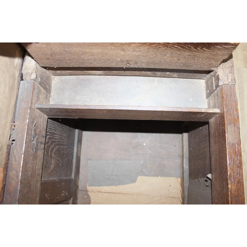 195 - An antique oak coffer with carved details and candle box to interior, likely 18th century, unusual s... 