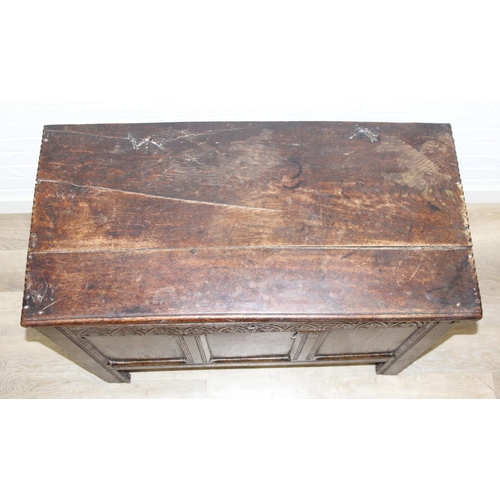 195 - An antique oak coffer with carved details and candle box to interior, likely 18th century, unusual s... 