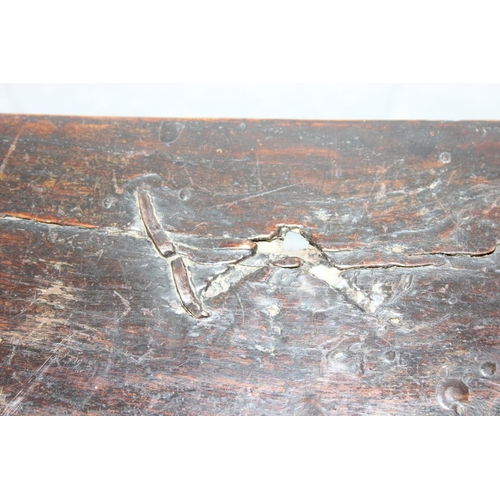 195 - An antique oak coffer with carved details and candle box to interior, likely 18th century, unusual s... 