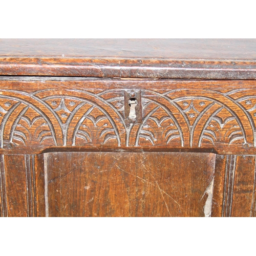 195 - An antique oak coffer with carved details and candle box to interior, likely 18th century, unusual s... 