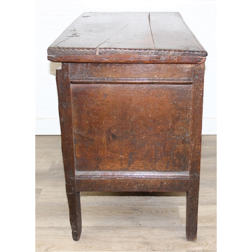 195 - An antique oak coffer with carved details and candle box to interior, likely 18th century, unusual s... 