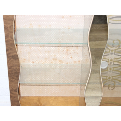 62 - A retro 1950's display or cocktail cabinet with mirror front and glass shelves, 91cm x 28cm x 93cm