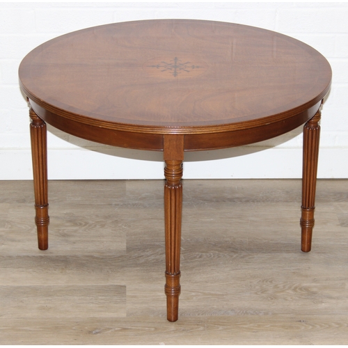 77 - An antique style low round table with inlay and reeded legs, to match library table lot following, 7... 