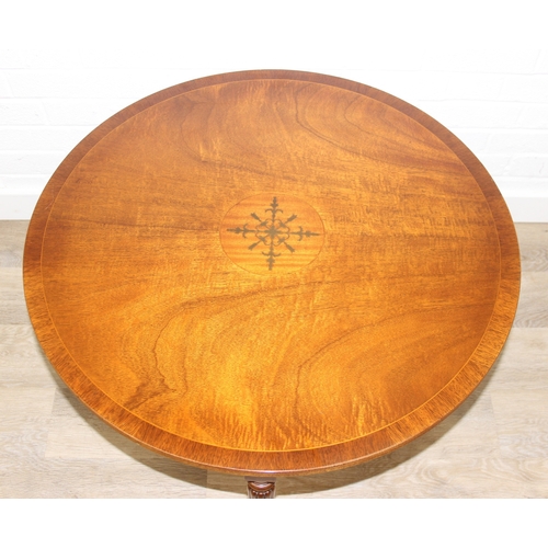 77 - An antique style low round table with inlay and reeded legs, to match library table lot following, 7... 