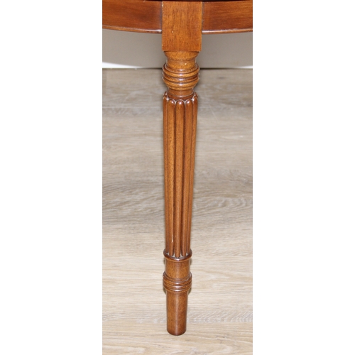 77 - An antique style low round table with inlay and reeded legs, to match library table lot following, 7... 