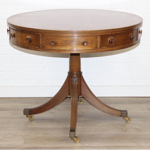 78 - An antique style drum or library table with inlay, four real drawers and four faux drawers, 91cm in ... 
