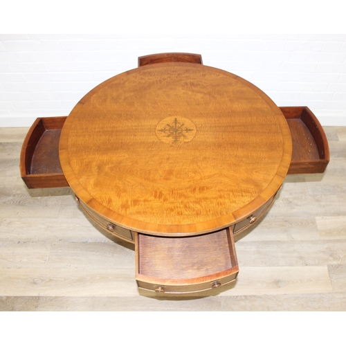 78 - An antique style drum or library table with inlay, four real drawers and four faux drawers, 91cm in ... 