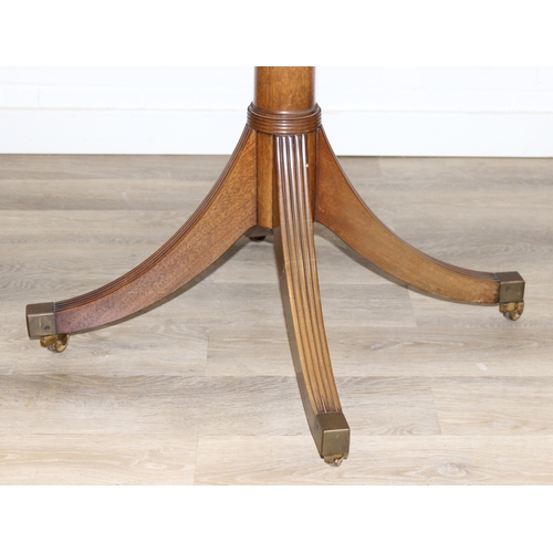 78 - An antique style drum or library table with inlay, four real drawers and four faux drawers, 91cm in ... 