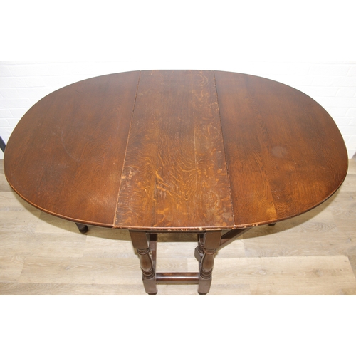 82 - A 17th century style Oak gate-leg table with turned legs, 92cm x 41cm (137cm when open) x 77cm