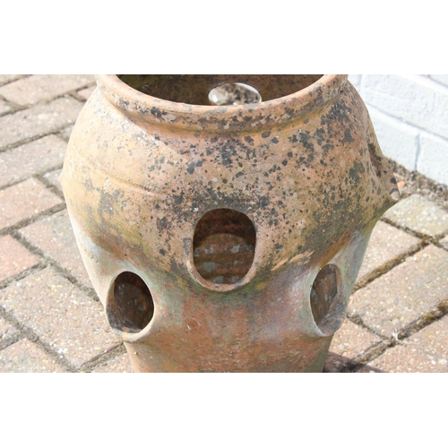 309 - A vintage weathered terracotta garden strawberry planter, 42cm tall, one of four available in the sa... 