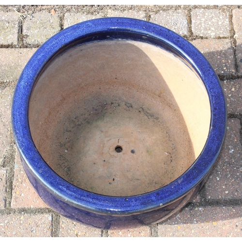 311 - Two blue glazed garden planters or pots, the largest 40cm in diameter x 23cm tall [2]