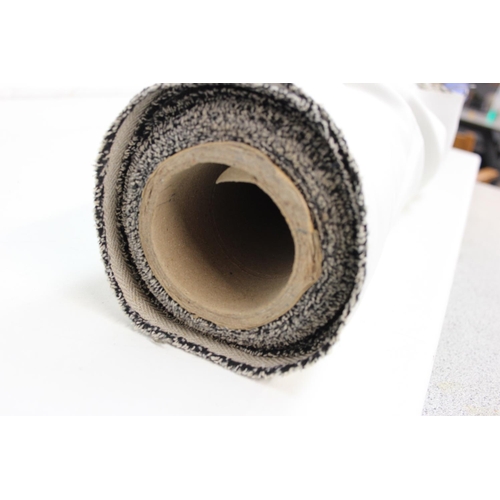 207 - A large roll of fabric, a light grey herringbone tweed style pattern, 3m long, many meters on roll